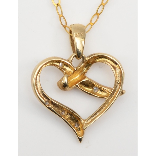 360 - A 9ct gold heart shaped pendant, set with eight cut diamonds, on chain, 12 x 13mm, 1.3gm.