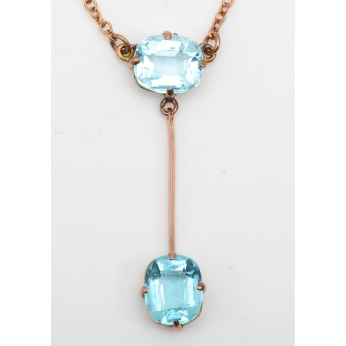 366 - An Edwardian 9ct rose gold blue paste stone drop necklace, 34mm, 3.3gm.