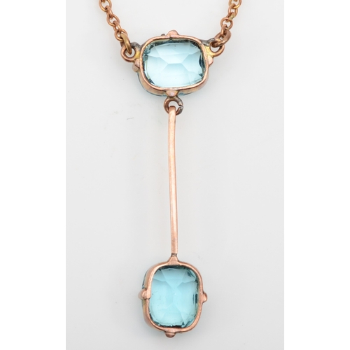 366 - An Edwardian 9ct rose gold blue paste stone drop necklace, 34mm, 3.3gm.