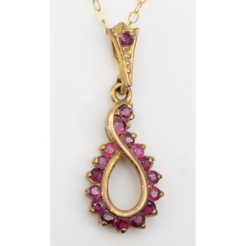 368 - A 9ct gold ruby pendant on chain, 27mm, 2.1gm.