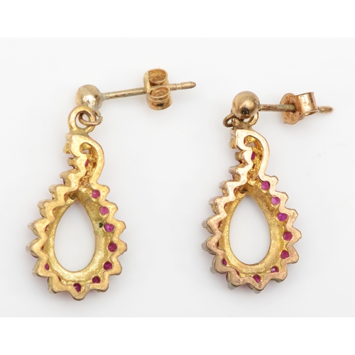 369 - A pair of 9ct gold ruby drop earrings, 23mm, 2.8gm.