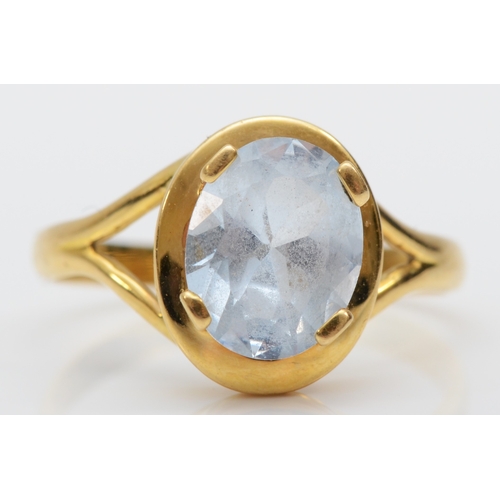 372 - A 750 gold synthetic blue spinel dress ring with continental control mark, Q, 3.6gm.