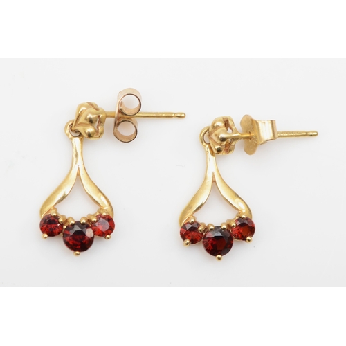 373 - A pair of 9ct gold garnet drop earrings, 17mm,  1.3gm.