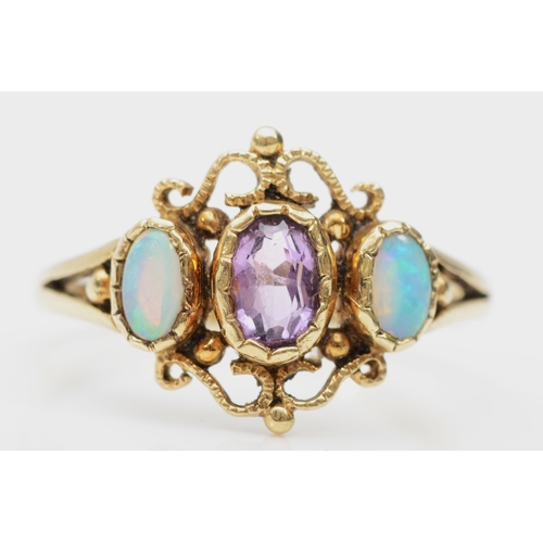 374 - A 9ct gold opal and amethyst three stone dress ring, P, 2gm.