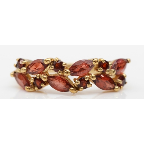 384 - A 9ct gold garnet dress ring, P-Q, 3.2gm.