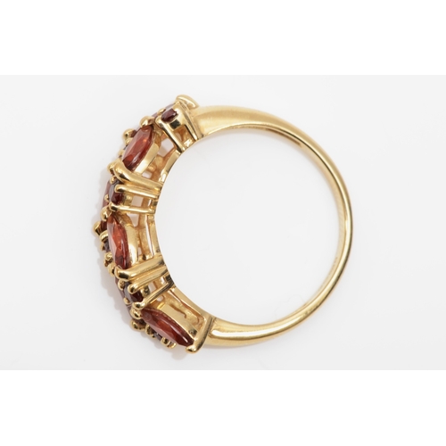 384 - A 9ct gold garnet dress ring, P-Q, 3.2gm.