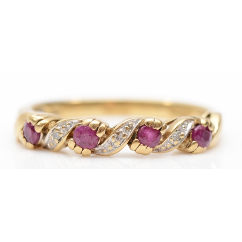 385 - A 9ct gold ruby and diamond dress ring, N-O, 2.1gm.