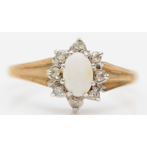 386 - A 9ct gold opal and eight cut diamond cluster ring N-O, 1.7gm.