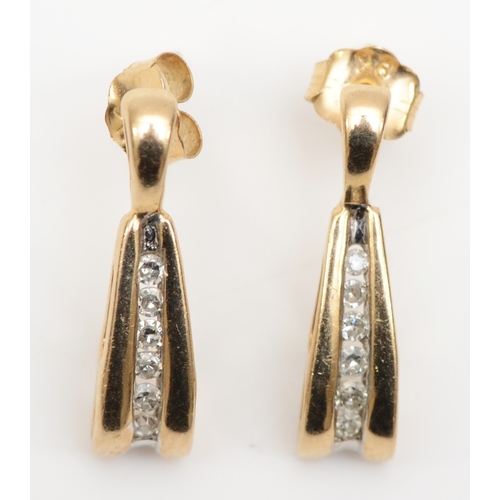 387 - A pair of 9k gold channel set brilliant cut diamond drop earrings, 17mm, 1.4gm.