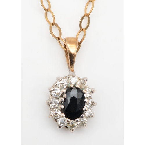 389 - A 9ct gold sapphire and cubic zirconia cluster pendant, on chain, 16 x 7mm, 2.2gm.