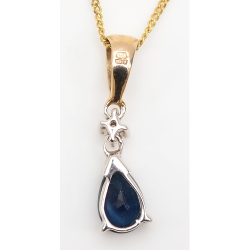 391 - A 9ct gold pear cut sapphire and diamond pendant, on fine link chain, 17mm, 1.2gm