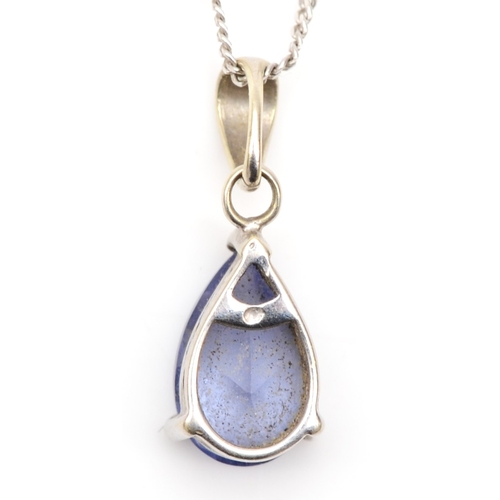 394 - An unmarked white gold blue cubic zirconia drop pendant, on chain, 15mm, 1.3gm.