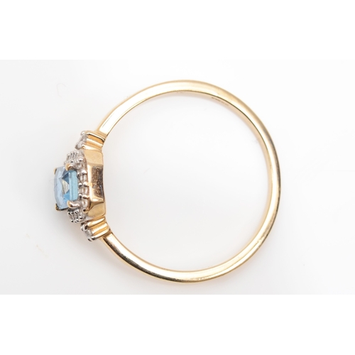 403 - A 9ct gold aquamarine and cubic zirconia cluster ring,