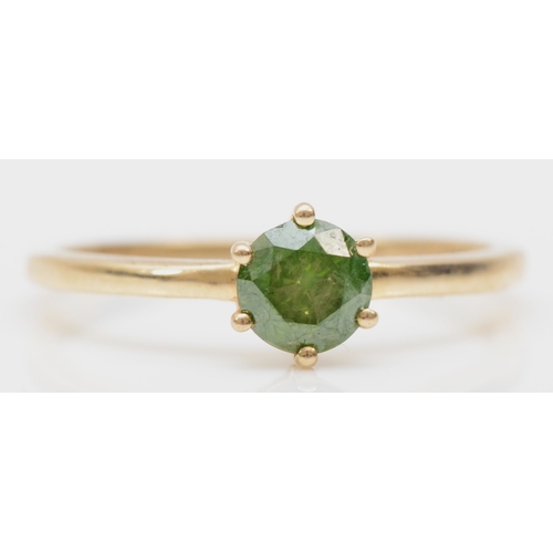 412 - A 9ct gold synthetic/treated green brilliant cut diamond solitaire ring, O, 1.3gm.