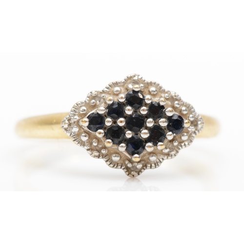 415 - A 9ct gold sapphire and diamond cluster ring, Q, 2.4gm.