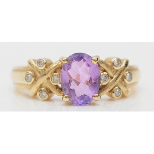 419 - A 9ct gold amethyst and diamond dress ring, N, 3.8gm.