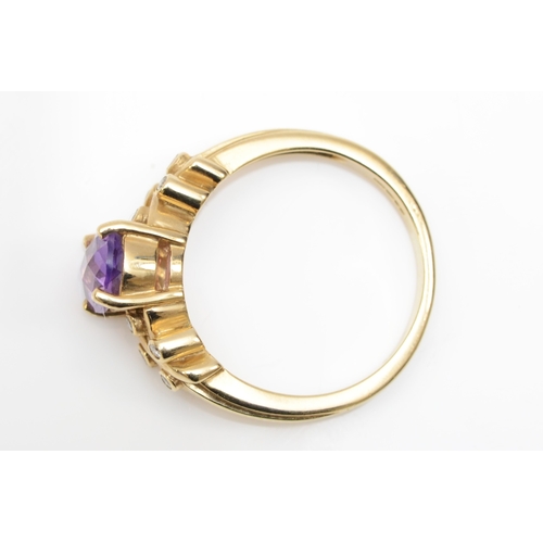 419 - A 9ct gold amethyst and diamond dress ring, N, 3.8gm.