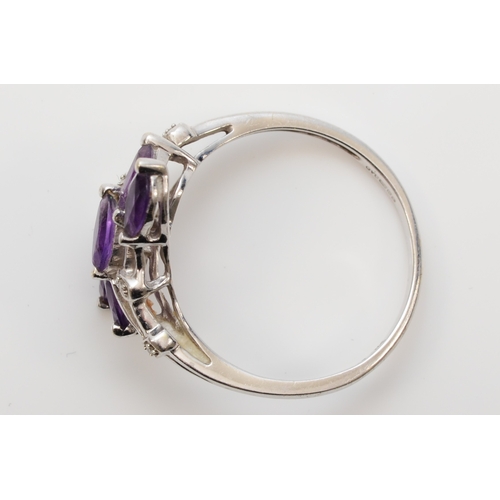 424 - A 9ct white gold amethyst and diamond dress ring, T, 2.5gm.