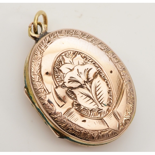 425 - An unmarked gold front and backed oval locket, with chased decoration, 26 x 18mm, 6.9gm.