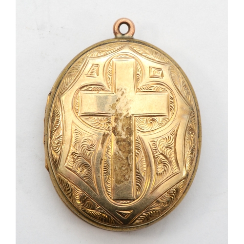 428 - An unmarked gold front and backed oval locket, with foliate and cross chased decoration, 38 x 28mm, ... 