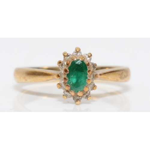 429 - A 9ct gold emerald and diamond cluster ring, I, 1.8gm.