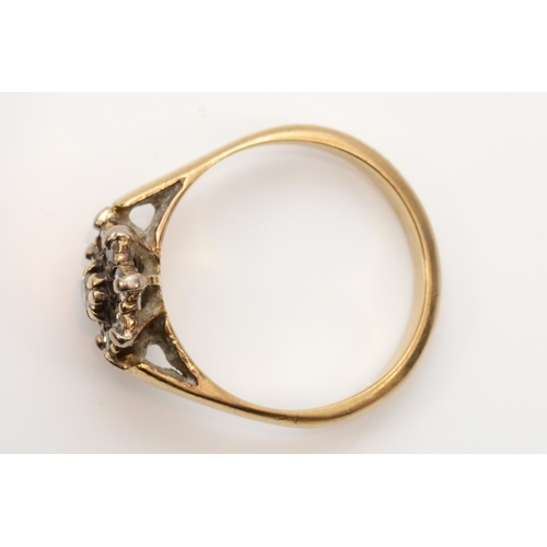 431 - An unmarked gold brilliant cut diamond cluster ring, J, 2gm.