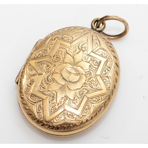 433 - An unmarked gold front and backed oval locket, with geometric and foliate chased decoration, 31 x 23... 