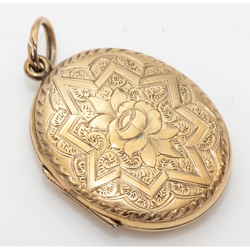 433 - An unmarked gold front and backed oval locket, with geometric and foliate chased decoration, 31 x 23... 