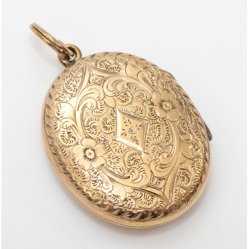 433 - An unmarked gold front and backed oval locket, with geometric and foliate chased decoration, 31 x 23... 