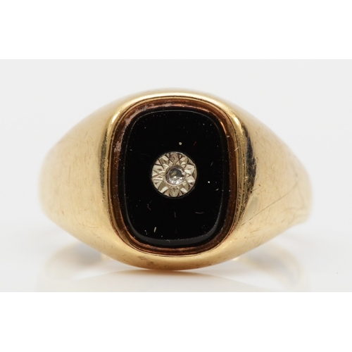 474 - A 9ct gold onyx and diamond signet ring, K, 2.6gm.