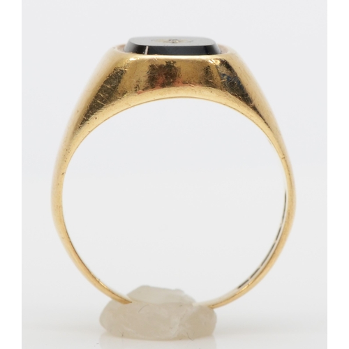 474 - A 9ct gold onyx and diamond signet ring, K, 2.6gm.