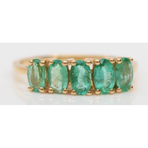 486 - A 9ct gold five stone emerald dress ring, M, 1.4gm.