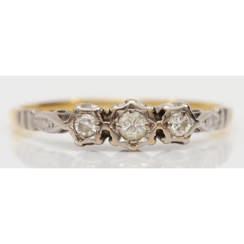 488 - An unmarked gold illusion set brilliant cut diamond ring, U, 2.5gm.