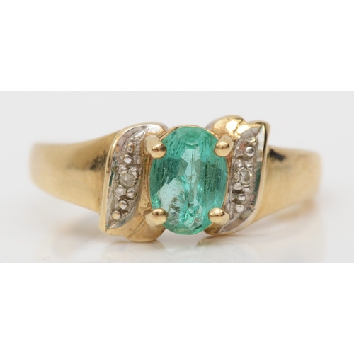 489 - A 9ct gold synthetic emerald dress ring, with diamond shoulders, L, 3.5gm.