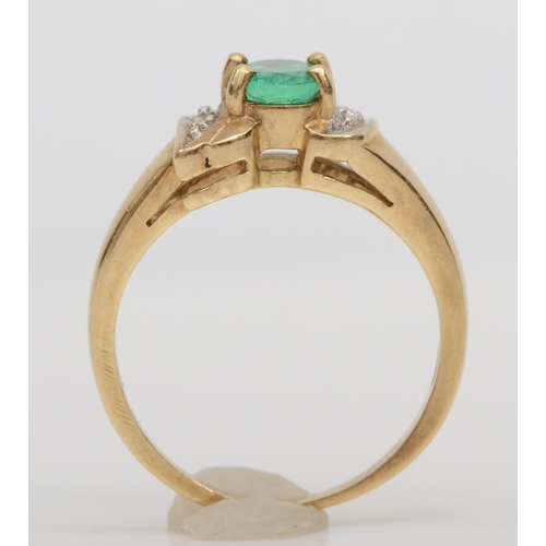 489 - A 9ct gold synthetic emerald dress ring, with diamond shoulders, L, 3.5gm.