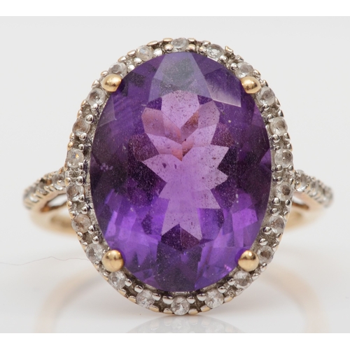 492 - A 9ct gold amethyst and white sapphire dress ring, O, 4.1gm.