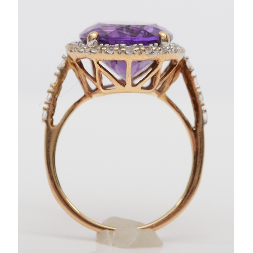 492 - A 9ct gold amethyst and white sapphire dress ring, O, 4.1gm.