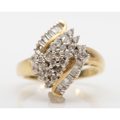 497 - A 9ct gold brilliant and baguette cut diamond cluster ring, N, 4gm.