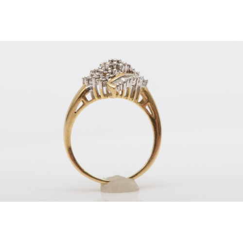 497 - A 9ct gold brilliant and baguette cut diamond cluster ring, N, 4gm.