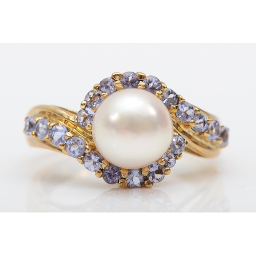 501 - A 9ct gold cultured pearl and tanzanite dress ring, L, 3.4gm.