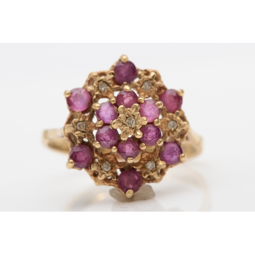 502 - A 9ct gold ruby and diamond cluster ring, O-P, 3gm.