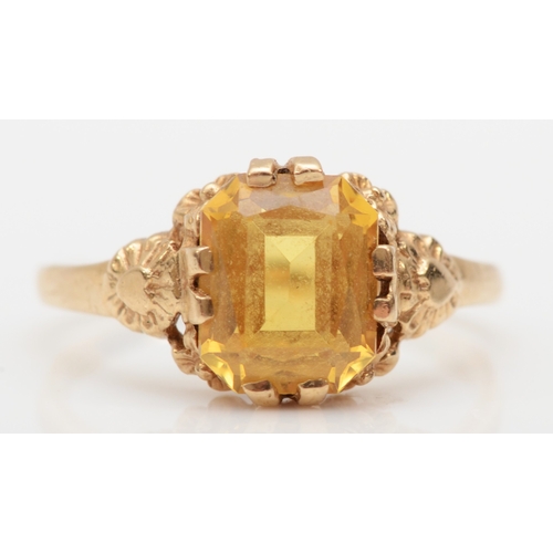 507 - A 9ct gold synthetic yellow sapphire dress ring, K, 1.8gm.