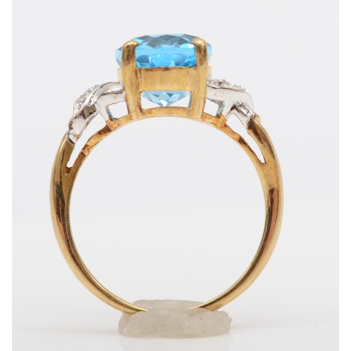 508 - A 9ct gold blue topaz and diamond dress ring, L, 2.7gm.