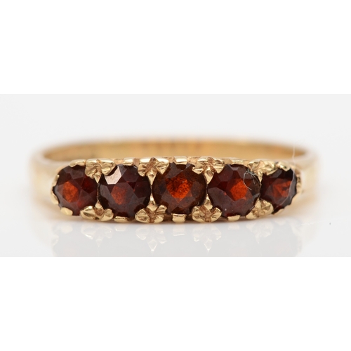 509 - A 9ct gold five stone garnet dress ring, L, 2gm.