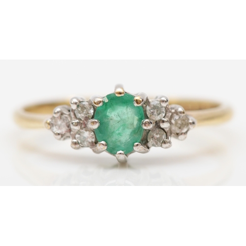 510 - A 9ct gold emerald and diamond dress ring, J, 1.3gm.