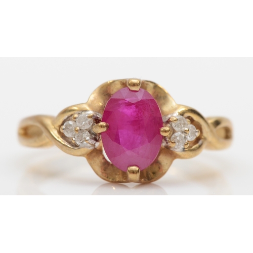 516 - A 9ct gold synthetic ruby and brilliant cut diamond dress ring, K, 2gm.