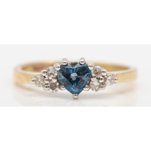 518 - A 9ct gold heart shaped London blue topaz and diamond dress ring, K, 2.1gm.