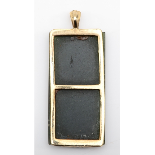 521 - A 9ct gold mounted nephrite pendant, with inscribed Chinese characters, 48 x 20mm, 11.2gm.