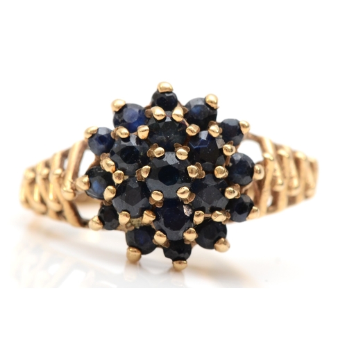 525 - A 9ct gold sapphire cluster ring, N, 3.5gm.