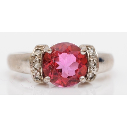 528 - A 9ct white gold coated pink topaz and diamond dress ring, O, 3.5gm.